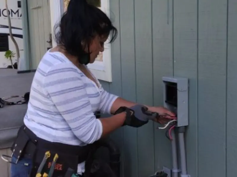 Licensed electrician wiring an exterior subpanel in Reidland