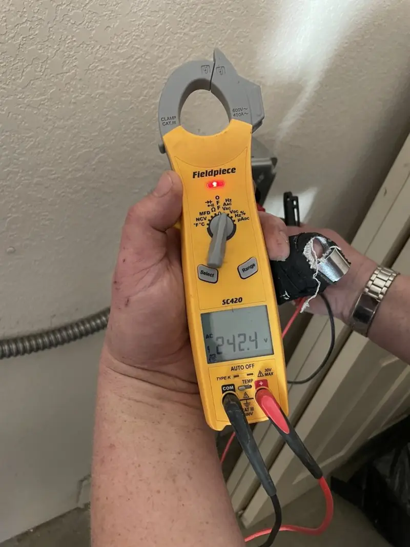 Voltage testing with clamp meter during Ceiling Fan Installation in Reidland